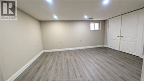 Windsor apartment for rent - A room with a wooden floor and white walls.