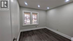 Windsor apartment for rent - A room with a window and a wooden floor.
