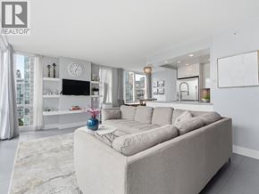 Vancouver apartment for rent - A modern kitchen with white cabinets and a black and white checkered bench.