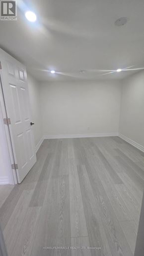 Oshawa (Donevan) apartment for rent - A room with a white door and grey flooring.
