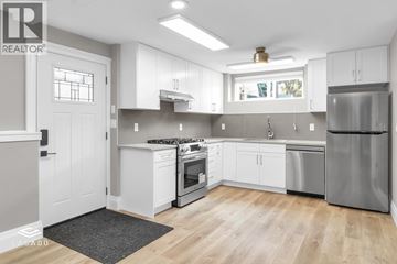 Port Coquitlam apartment for rent - A modern kitchen with white cabinets and stainless steel appliances.