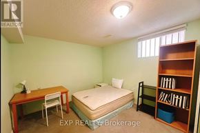 Toronto (Newtonbrook East) apartment for rent - A bedroom with a bed, desk, and bookshelf.