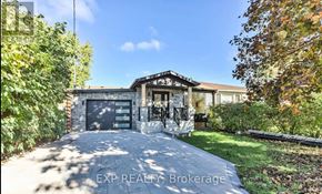 Richmond Hill (Crosby) apartment for rent - A house with a driveway and a garage door.