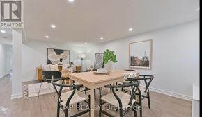 Richmond Hill (Crosby) apartment for rent - A dining room with a table set for four and a framed picture on the wall.