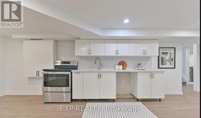 Richmond Hill (Crosby) apartment for rent - A modern kitchen with white cabinets and stainless steel appliances.