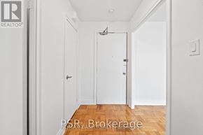 Toronto (Stonegate-Queensway) multi-family for rent - A hallway with a door on the right and a door on the left.