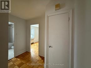 Toronto (Stonegate-Queensway) multi-family for rent - A white door is in a room with a wooden floor.