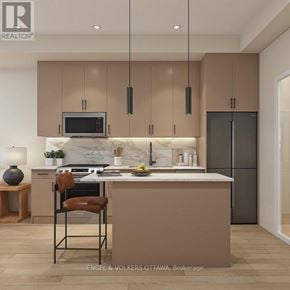 Brockville apartment for rent - A modern kitchen with brown cabinets and a marble backsplash.