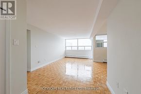 Toronto (Maple Leaf) condo for rent - A room with wooden flooring and a window letting in light.