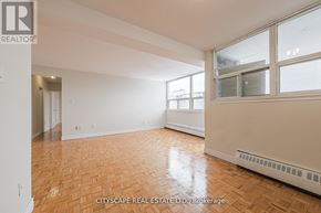 Toronto (Maple Leaf) condo for rent - A room with wooden flooring and white walls, with a window on the right side.