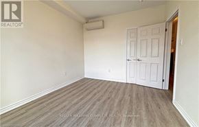 Hamilton (Stinson) apartment for rent - A room with a white door and a wooden floor.