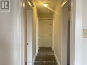 Hamilton (Crown Point) multi-family for rent - A hallway with a door at the end and a light on the ceiling.