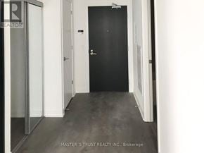 Toronto (Church-Yonge Corridor) condo for rent - A hallway with a black door and a glass door on the left.
