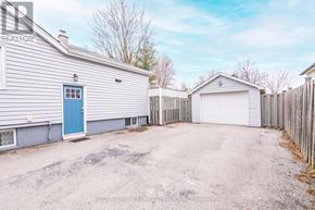 Burlington (Freeman) apartment for rent - A house with a blue door and a garage is for sale.