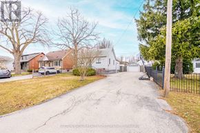 Burlington (Freeman) apartment for rent - A residential street with houses on both sides and a car parked on the left.