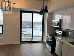 Brantford condo for rent - A kitchen with a microwave on the counter.