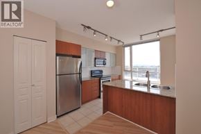 Vancouver apartment for rent - A kitchen with a refrigerator, microwave, and sink.
