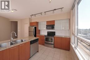 Vancouver apartment for rent - A kitchen with wooden cabinets and stainless steel appliances.
