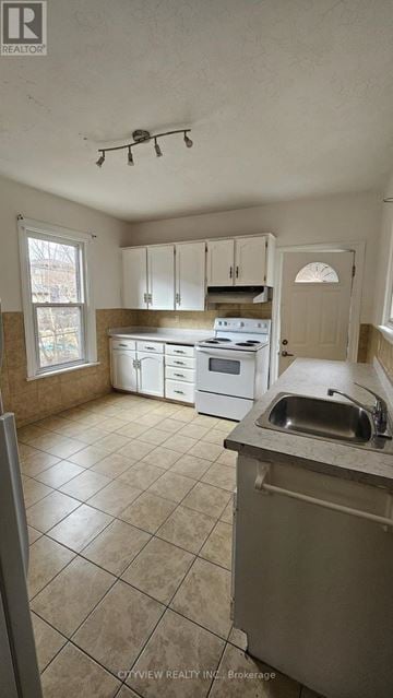 Hamilton (Landsdale) apartment for rent - A kitchen with white cabinets and a stove top oven.