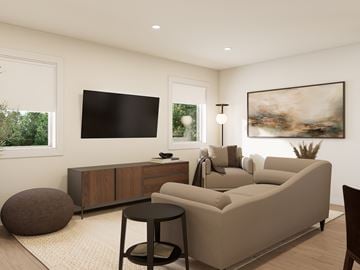 Moncton apartment for rent - A modern living room with a large couch, a TV, and a painting on the wall.