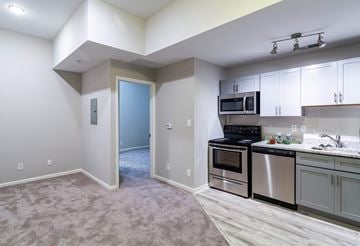 Charleston apartment for rent - A kitchen with a microwave, oven, and stove top.