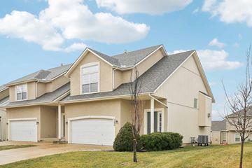 Gardner apartment for rent - A large, two-story house with a garage on the left side.