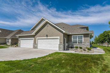 Gardner apartment for rent - A house with a grey roof and two white garage doors.