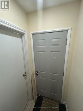 Ajax (Northeast Ajax) apartment for rent - A white door with a black mat in front of it.
