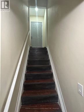 Ajax (Northeast Ajax) apartment for rent - A staircase with a light switch on the wall.