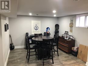 Hamilton (Berrisfield) apartment for rent - A dining room with a guitar and a skateboard.