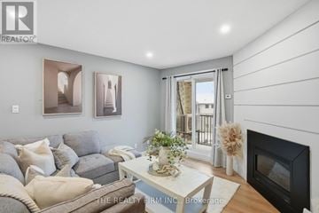 London South (South T) condo for rent - A living room with a grey couch and a fireplace.