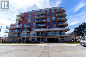 Toronto (Scarborough Village) condo for rent - A multi-story apartment building with a red and white facade.