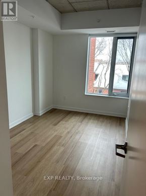 Ottawa apartment for rent - A room with a window and a door handle.