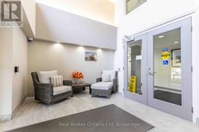 Owen Sound condo for rent - A brokerage office with a sign that says Real Broker Ontario Ltd.