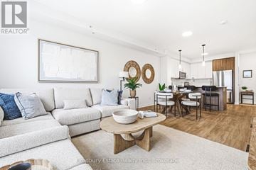 Cambridge condo for rent - A modern living room with a white couch and a wooden coffee table.