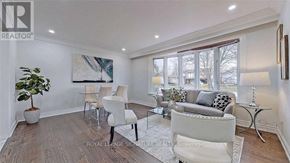 Ajax (Northwest Ajax) apartment for rent - A living room with white furniture and a painting on the wall.