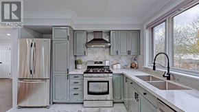 Ajax (Northwest Ajax) apartment for rent - A kitchen with a stove top oven and a refrigerator.