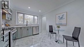 Ajax (Northwest Ajax) apartment for rent - A modern kitchen with a glass table and chairs.