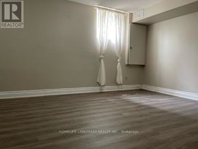 Richmond Hill (Oak Ridges) apartment for rent - A room with a window and curtains is on the market.