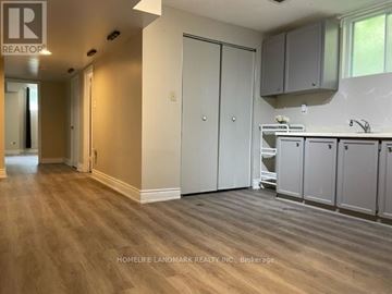 Richmond Hill (Oak Ridges) apartment for rent - A kitchen area with cabinets and a sink.