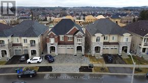 Richmond Hill (Oak Ridges) apartment for rent - A brokerage sign is displayed on a building in a residential area.
