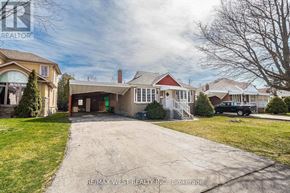 Toronto (Yorkdale-Glen Park) apartment for rent - A house with a driveway in front of it.