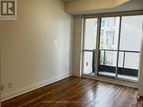 Markham (Unionville) condo for rent - A room with a sliding glass door leading to a balcony.