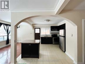 Richmond Hill (Crosby) apartment for rent - A kitchen with a refrigerator, oven, and sink.