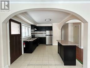 Richmond Hill (Crosby) apartment for rent - A kitchen with black cabinets and a countertop is shown.