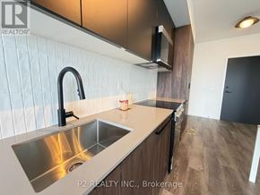 Toronto (Centennial Scarborough) condo for rent - A bathroom with a toilet, sink, and bathtub.