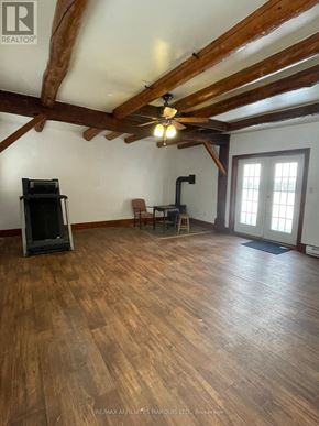 South Glengarry apartment for rent - A room with wooden floors and a ceiling fan.