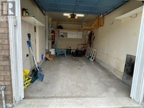 Brampton (Fletcher's Meadow) apartment for rent - A garage with a blue ceiling and a fire extinguisher on the wall.