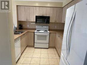 Brampton (Fletcher's Meadow) apartment for rent - A kitchen with a white refrigerator on the right.