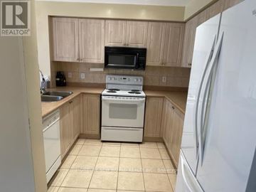 Brampton (Fletcher's Meadow) apartment for rent - A kitchen with a white refrigerator on the right.